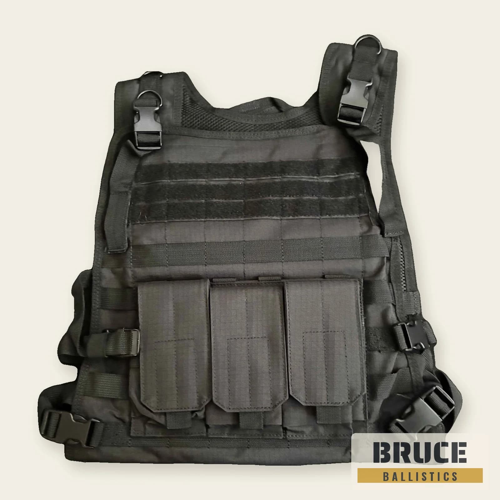 MOLLE tactical vest in black, front: triple rifle magazine pouch, utility pouches, MOLLE webbing and quick-release shoulder buckles